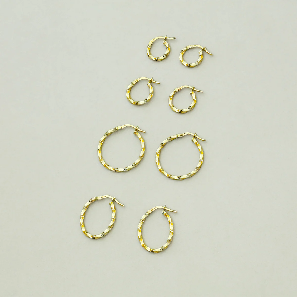 Soleil Collection Oval Twist Hoop Earrings | 9K Yellow Gold - Image 7